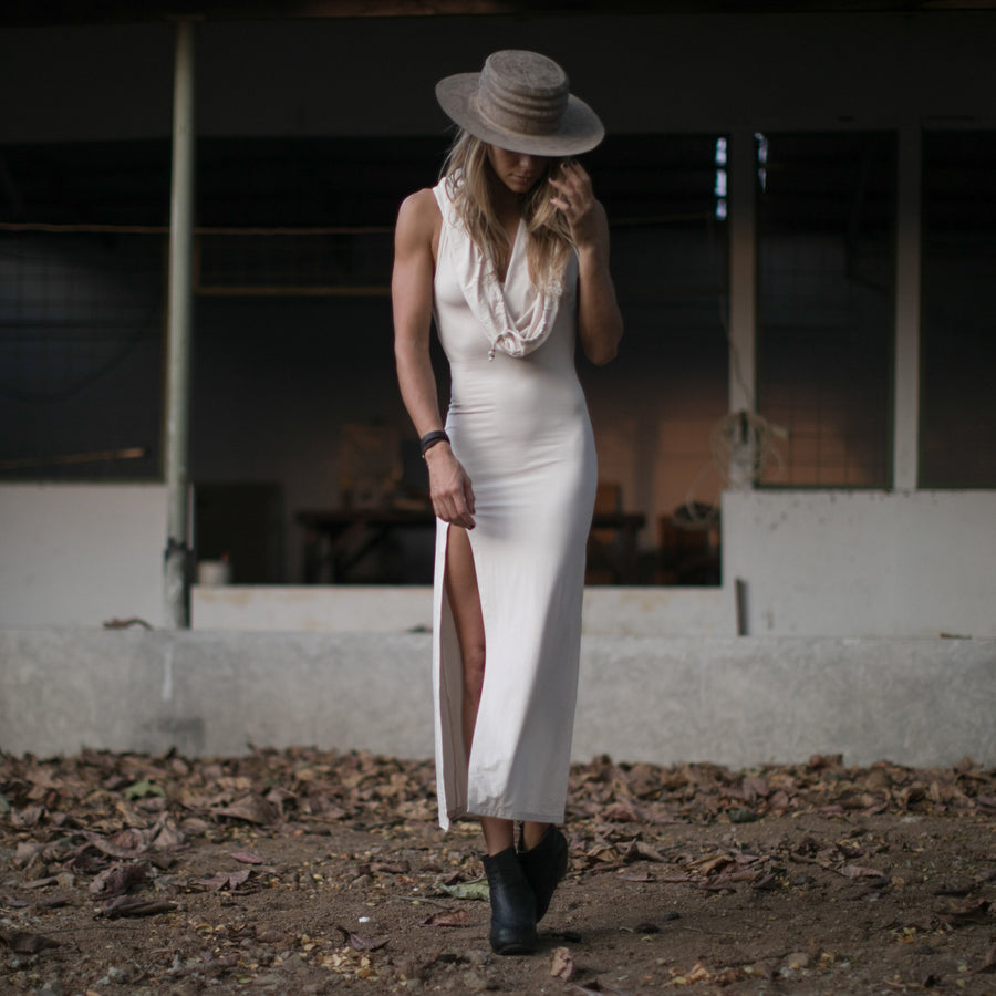 Long maxi dress made of very soft natural, breathable fiber. With a cowl neck piece that converts into a hood or a shawl. A wardrobe staple. Slow and sustainable fashion.